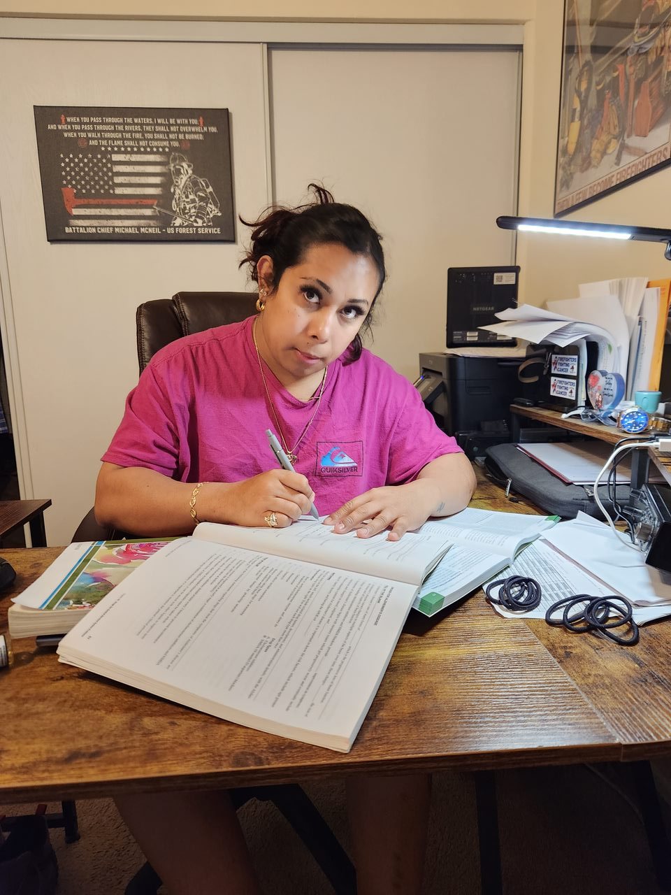 Zennin Sedacey-McNeil studying at the desk in Michael Karl McNeil's home office